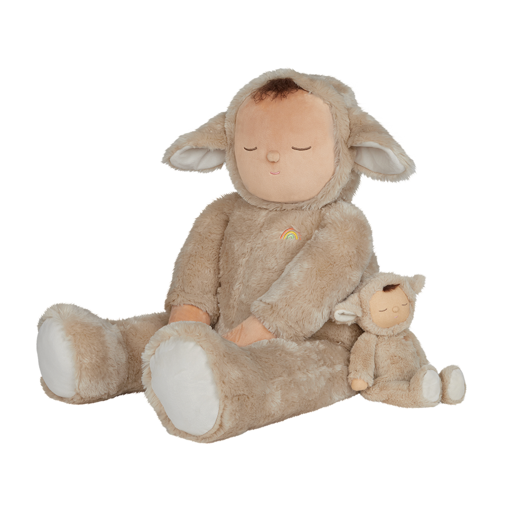 Cute plush doll in a fuzzy brown lamb suit with closed eyes, a peaceful expression, and a small rainbow emblem on its chest. Simple and cozy design.