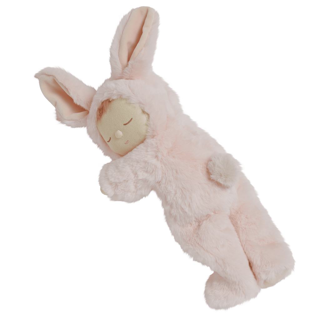 A plush doll in a pink bunny outfit with long ears, closed eyes, and a peaceful expression.