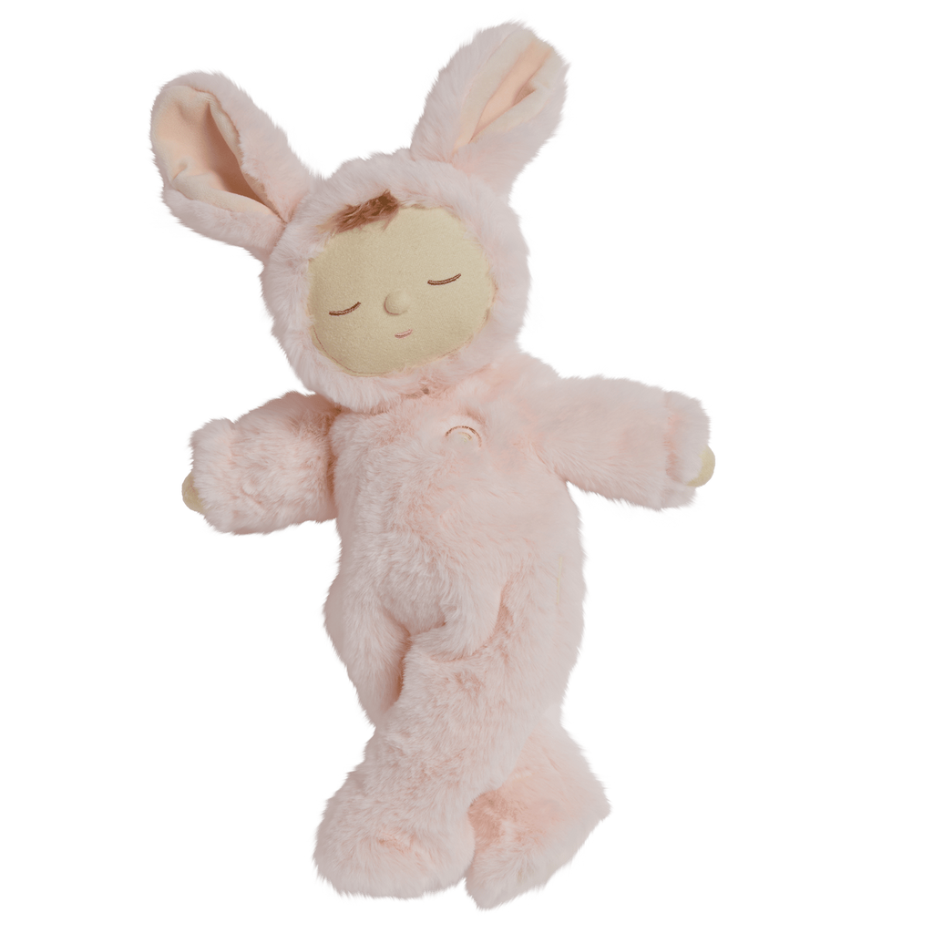 A plush doll in a pink bunny outfit with long ears, closed eyes, and a peaceful expression.