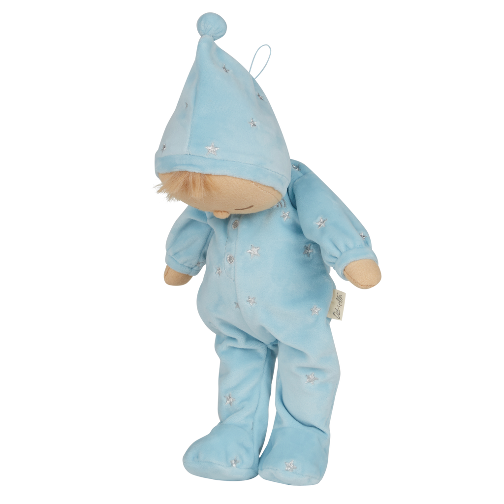 Soft plush doll dressed in a light blue outfit with a pointy hat, embroidered stars, and closed eyes, conveying a peaceful, sleepy tone.