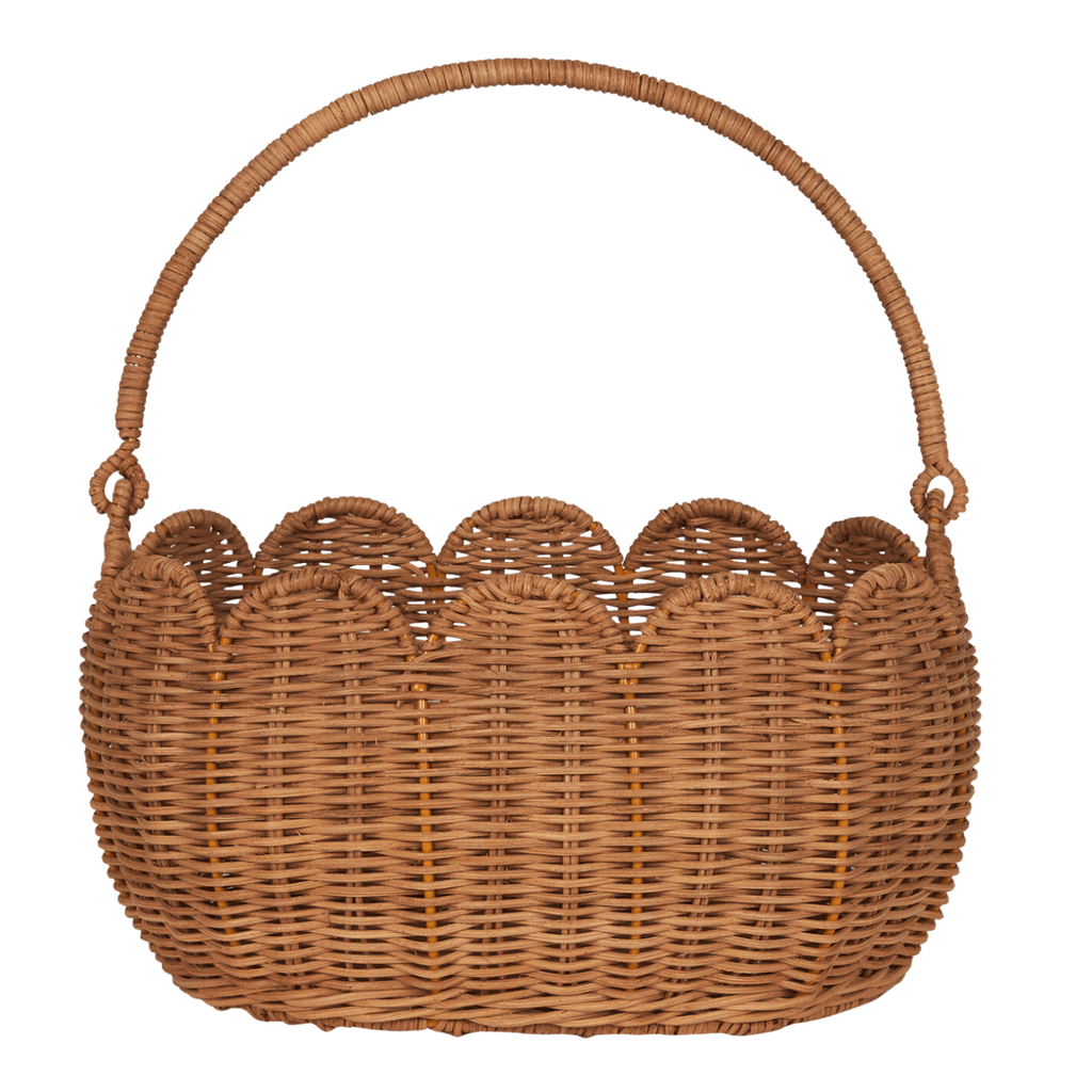 A woven wicker basket with a rounded handle and scalloped edge, set against a white background. The natural texture conveys a rustic, handmade feel.