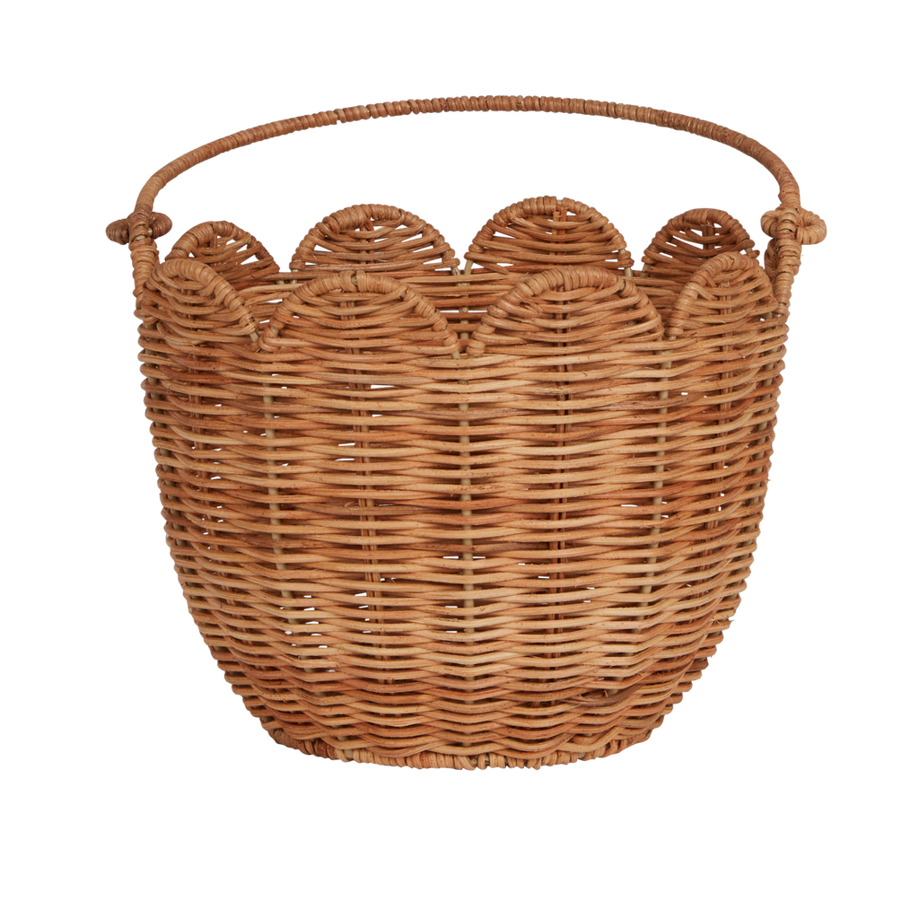 Woven wicker basket with a scalloped edge and a sturdy handle against a white background. The basket has a natural, handmade aesthetic.