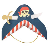 Blue paper pirate party hat with a skull, crossbones, a gold sword, and red and white striped brim.