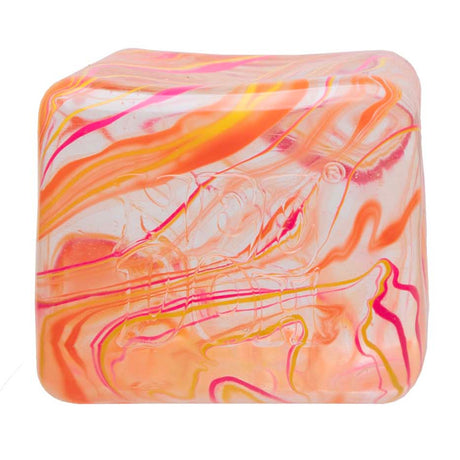 NeeDoh Niceberg Swirl cube squishy toy in orange and pink marbled pattern on a white background.
