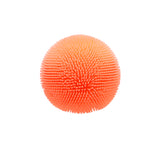 A bright orange rubbery ball covered in soft, flexible textured nubs against a plain white background.