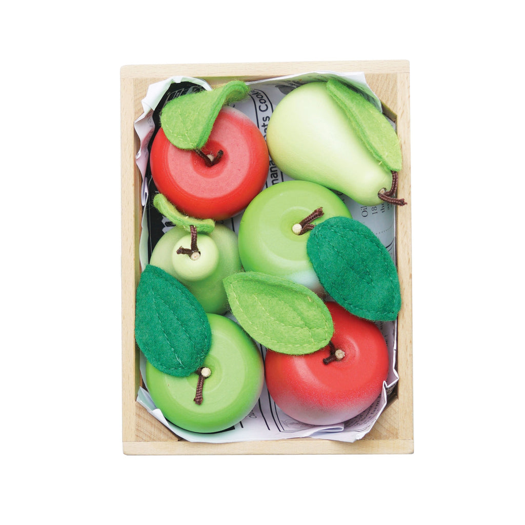 Wooden crate filled with brightly colored toy apples and pears, some red, some green. Felt leaves add a playful touch.