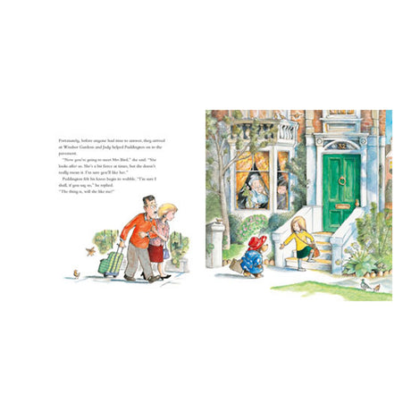 An open children's book shows Paddington Bear arriving at a house with the Brown family in a colorful illustration.