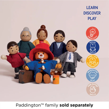 Wooden Paddington Bear figure sitting in front of wooden family figures with learning icons on the right.