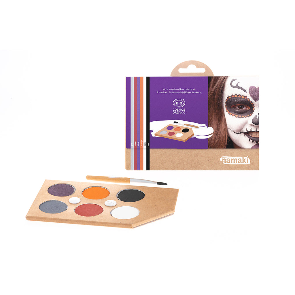 Namaki organic face painting kit with horror-themed colours, featuring an illustrated box with a child wearing a Día de los Muertos (Day of the Dead) skull face design, and an eco-friendly face paint palette.