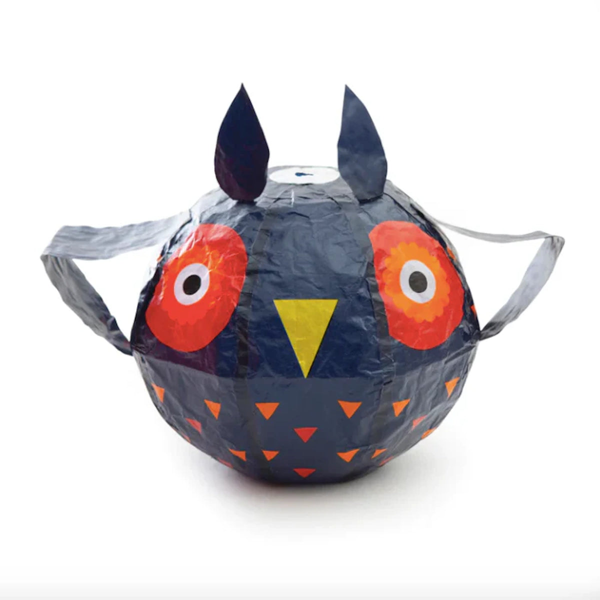 A balloon shaped like an owl with dark blue coloring, large red eyes, a yellow beak, and small triangular patterns. It has a playful and whimsical appearance.