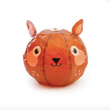 Orange paper lantern shaped like a cute animal head with big eyes, pink cheeks, and small ears. The expression is friendly and whimsical.