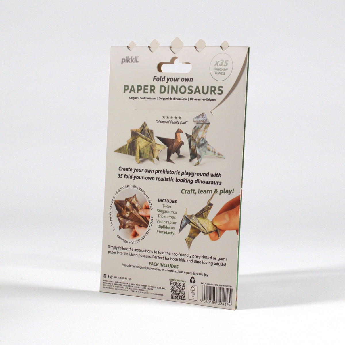 Back of "Paper Dinosaurs" origami kit packaging showing folded paper dinos and product details.