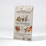 Back of "Paper Dinosaurs" origami kit packaging showing folded paper dinos and product details.
