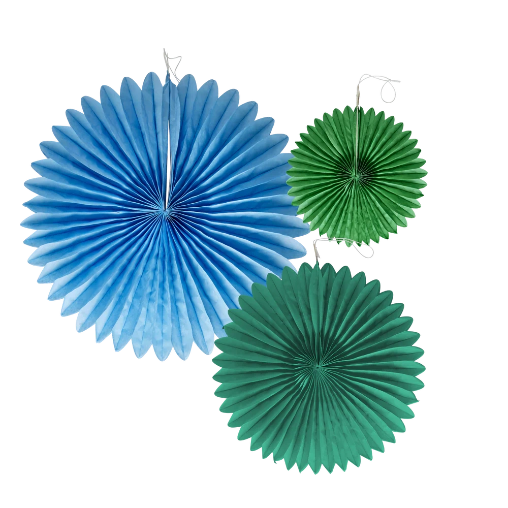 Three paper fan decorations against a white background: one large blue fan on the left and two smaller green fans on the right, evoking a festive atmosphere.