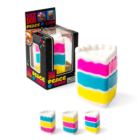 NeeDoh Peace O' Cake squishy toy with colorful pink, blue, and yellow layers next to its box.