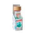 Sensory bottle in a cardboard box featuring a lighthouse, whale, and a wooden cap.