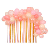 Assembled pink balloon garland kit featuring shades of pink, peach, and confetti balloons with crepe paper streamers.