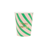Pink and green striped paper party cup with "Happy Birthday" written in gold script.