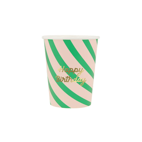 Pink and green striped paper party cup with "Happy Birthday" written in gold script.
