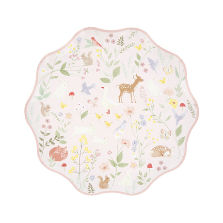 Scalloped paper plate with a pastel woodland animal and floral pattern.