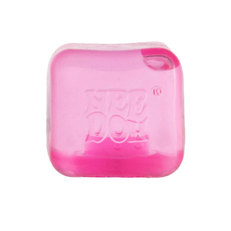 A translucent, square pink NeeDoh ice cube stress toy on a white background.