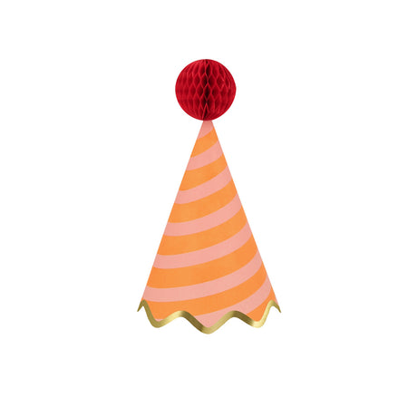 Orange striped party hat with a red honeycomb pom-pom and gold scalloped trim by Meri Meri on white background.