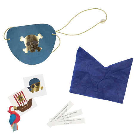 Blue pirate eye patch, stickers, pirate joke slips, and blue tissue paper unwrapped from a surprise ball.