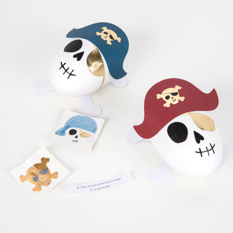 Two pirate skull surprise balls accompanied by pirate stickers and a joke slip.