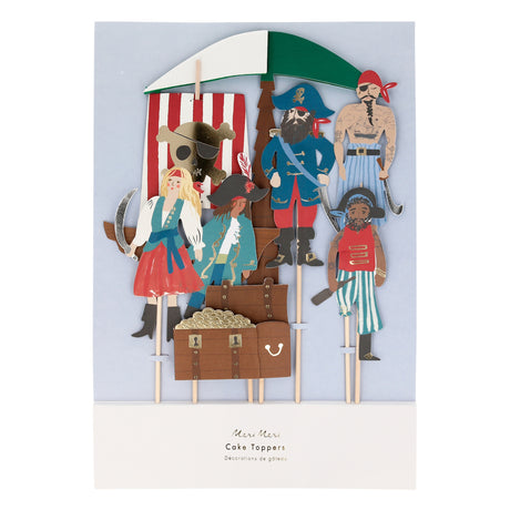 A set of pirate-themed cake toppers featuring characters, a ship sail, and a gold-filled treasure chest.