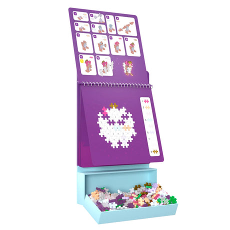 Plus-Plus Activity Pad Enchanted Forest set with 3D fairy instructions, puzzle guide, and colorful building pieces.