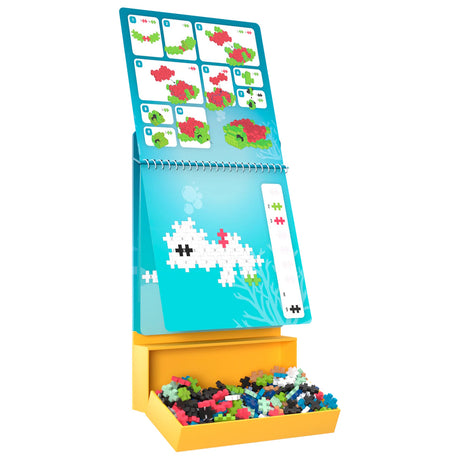 Plus-Plus Ocean Activity Pad with colorful building blocks, instructional flipbook, and sea turtle building guide.
