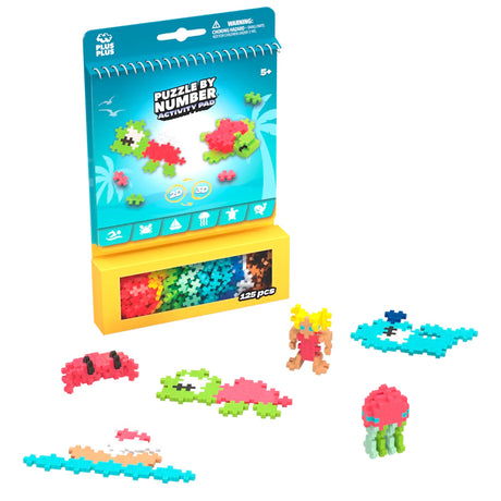 Plus-Plus Puzzle by Number Ocean Activity Pad with 125 colorful pieces and 2D and 3D sea creature brick builds.