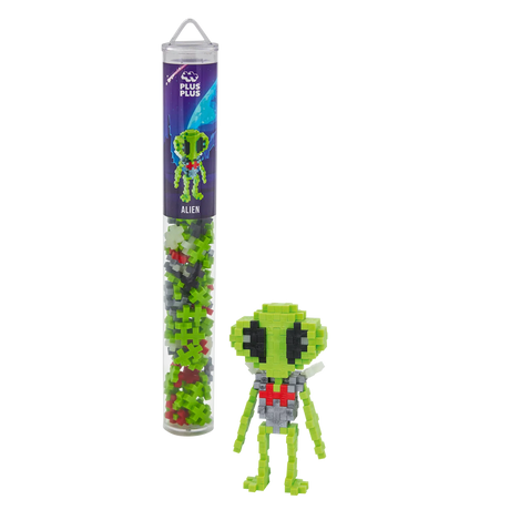 Plastic tube with colorful interlocking toy pieces and an assembled green alien figure beside it, set against a white background. Fun and creative.