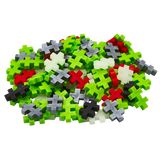 A pile of colorful plastic puzzle pieces shaped like plus signs. Pieces are red, green, white, gray, and black, set against a white background.