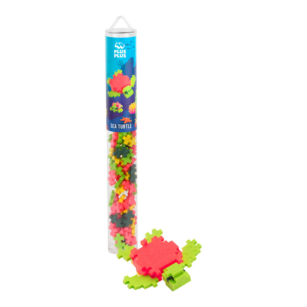 Clear tube containing colorful Plus-Plus building pieces with a small constructed sea turtle at the base. The label reads "Sea Turtle."