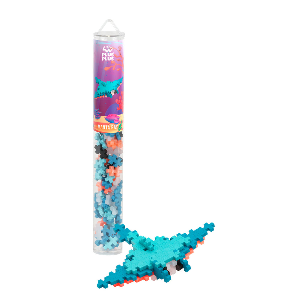 A clear tube containing multicolored interlocking pieces, labeled “Manta Ray,” with an assembled blue and orange manta ray model beside it.