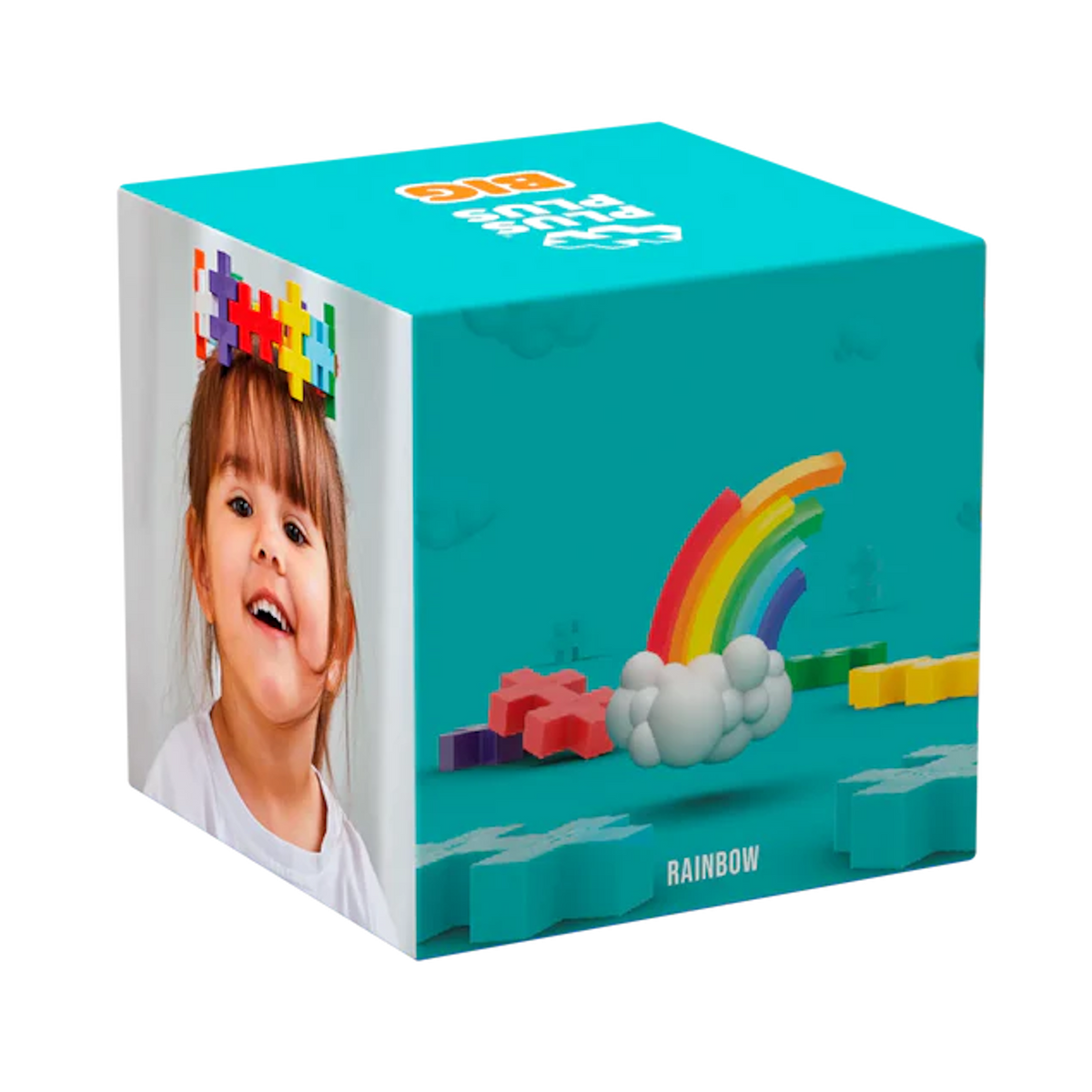 A colorful packaging box against a white background features a smiling child wearing multicolored puzzle pieces on their head. The box shows a rainbow with clouds and scattered puzzle blocks on a teal backdrop, suggesting fun and creativity.