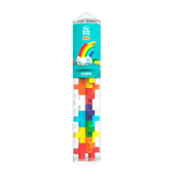 A transparent tube containing colorful, interlocking plus-shaped blocks is labeled "Plus Plus Big" with a cartoon cloud and rainbow on the packaging above.