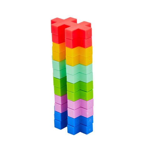 Tall vertical tower made of stacked, colorful Plus-Plus BIG tropical building pieces.