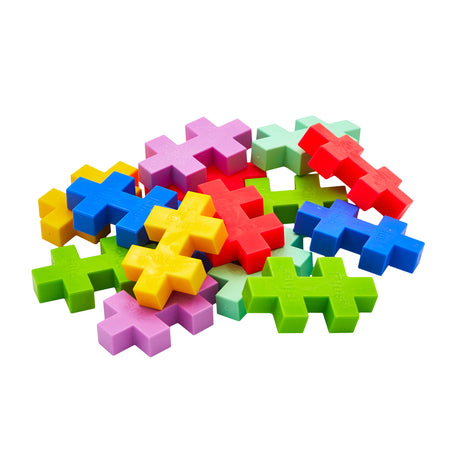 Pile of colorful Plus-Plus BIG tropical interlocking building blocks on a white background.