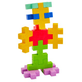 Toy figure constructed from colorful Plus-Plus BIG tropical interlocking blocks on white.