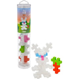 Plus-Plus BIG Bunny tube building set with a white toy bunny holding a carrot made of interlocking blocks.