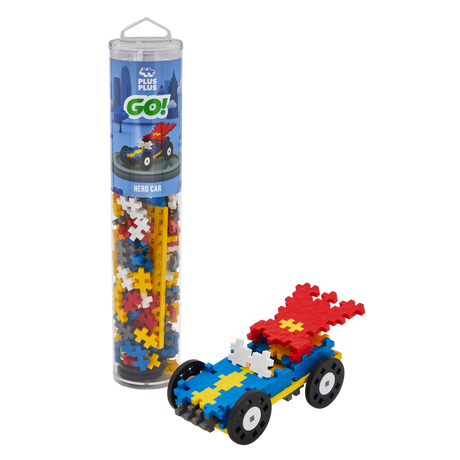 A tube labeled "Plus-Plus Go!" contains multicolored interlocking pieces. Beside it, a vibrant toy car with red wings is assembled from the pieces.