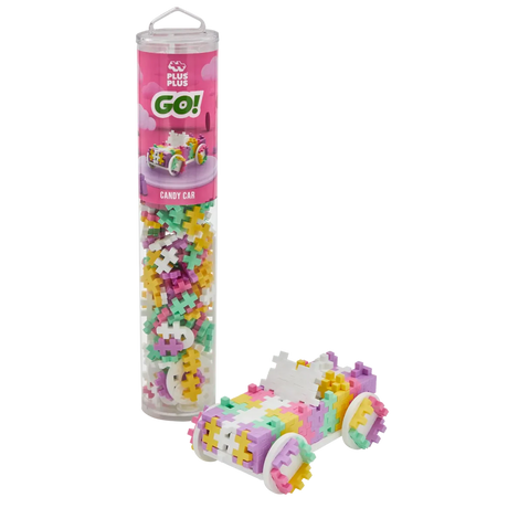 A colorful tube of Plus Plus GO! Candy Car interlocking blocks with a model car constructed beside it. The blocks are pastel pink, yellow, purple, and green.