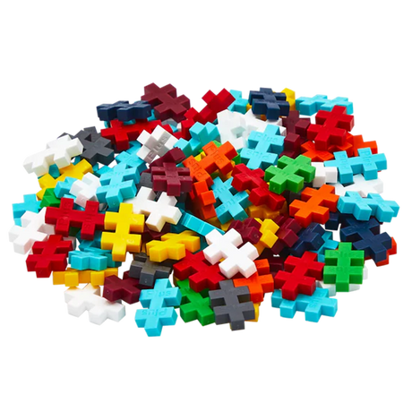 A pile of colorful interlocking plastic puzzle pieces in various shapes, including plus signs, scattered randomly on a white background.