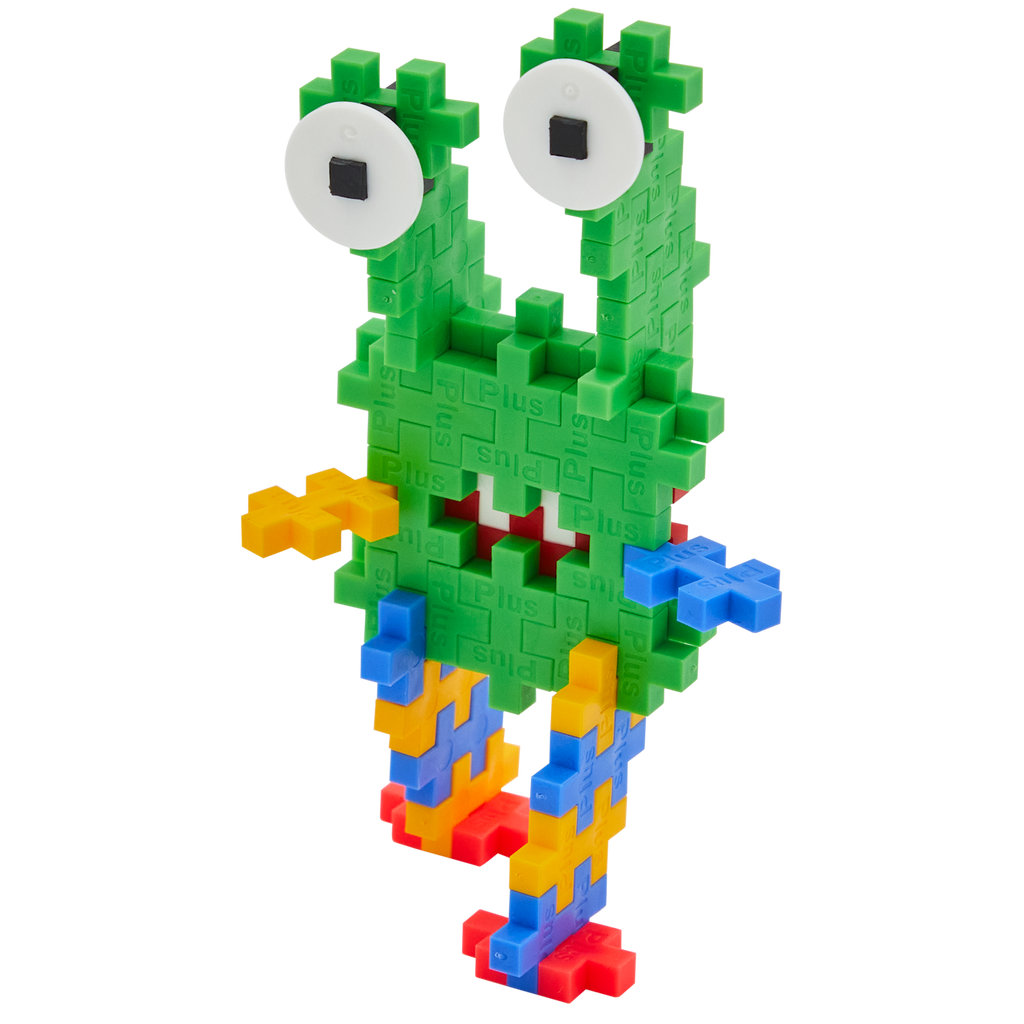 Colorful toy creature made of interlocking blocks with a green body, two large eyes, and multicolored limbs, conveying a playful, whimsical vibe.