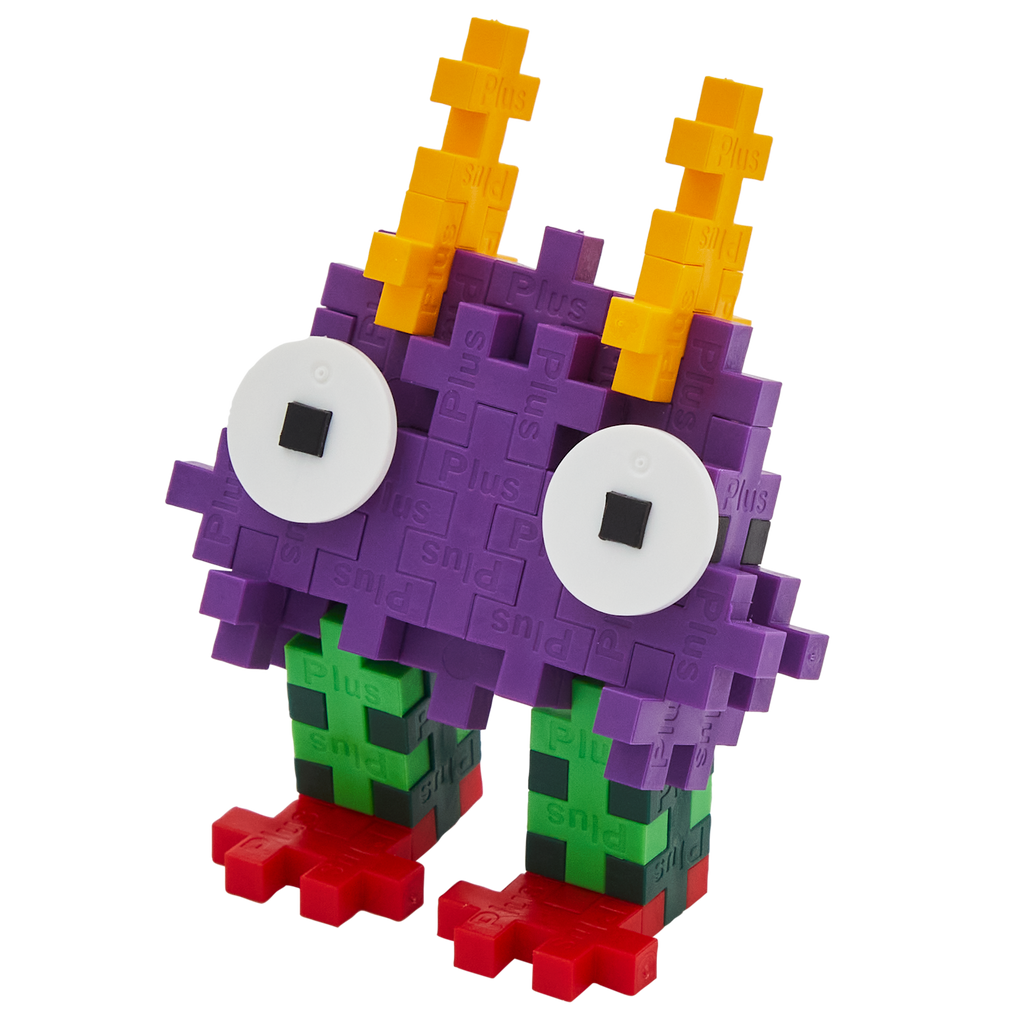 A colorful, blocky toy creature made of interlocking pieces on a white background. It has purple body, large white eyes, orange spikes, green legs, and red feet.