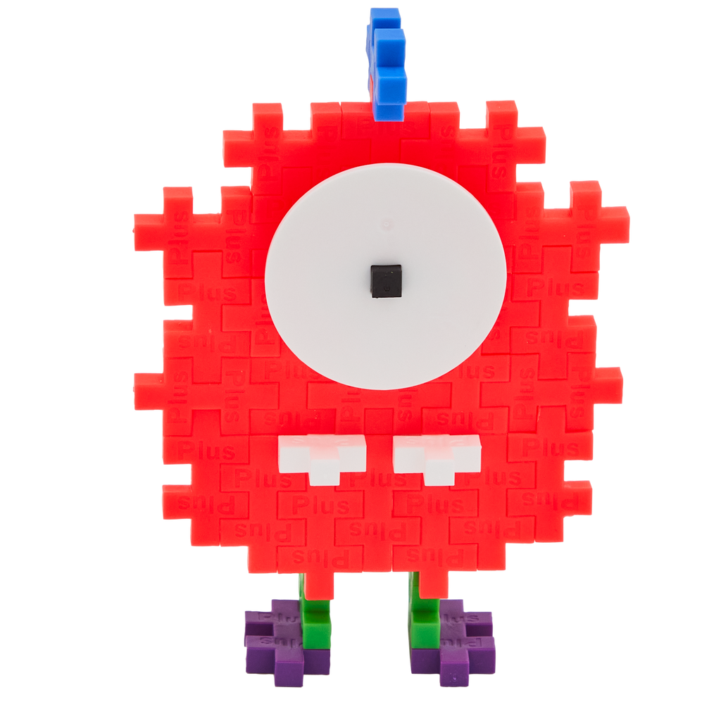 A playful creature made from Plus-Plus building pieces. It has a red pixelated body, large white eye with a black pupil, blue antenna, and green-purple feet.