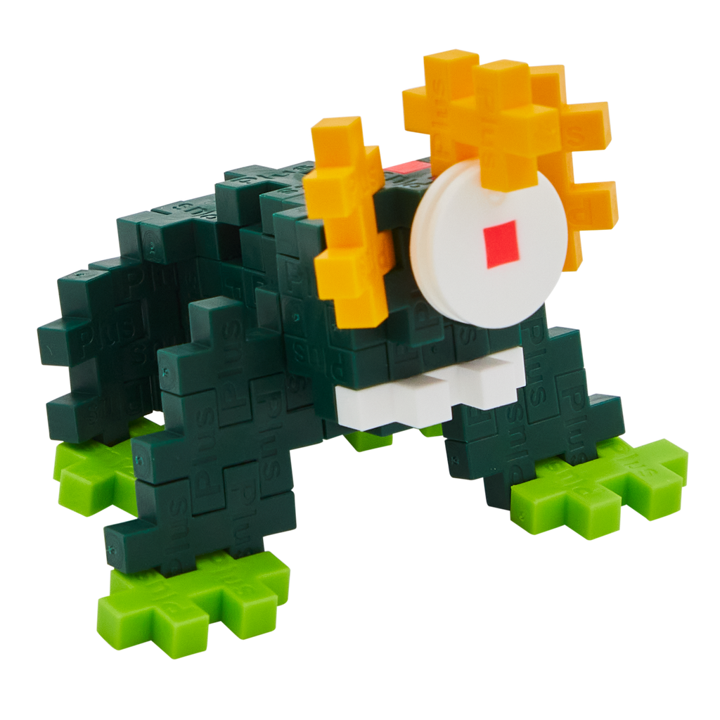 A blocky, frog-like creature made of interlocking pieces on a black background. It features dark green body, bright green feet, and yellow eyes.