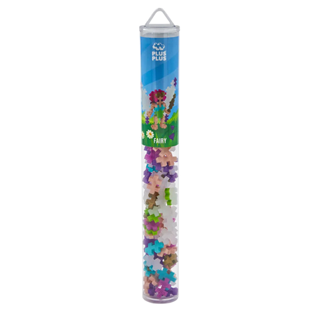 A transparent tube with colorful interlocking Plus-Plus blocks. The label features a playful fairy design with a nature theme and the word "FAIRY."